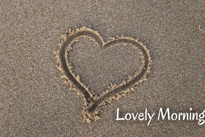 a heart draw on sand lovely morning